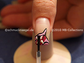 The clear nail lacquer protects the nail art