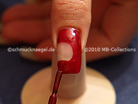 Nail lacquer in the colour dark red