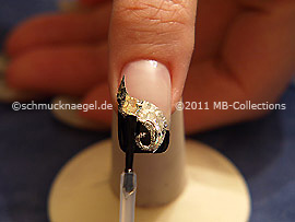 The clear nail lacquer protects the nail art