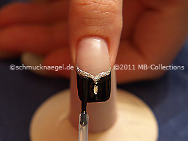 The clear nail lacquer protects the nail art