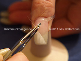 Tweezers and clear adhesive tape