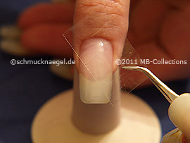 Clear adhesive tape and tweezers