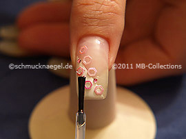 The clear nail lacquer protects the nail art