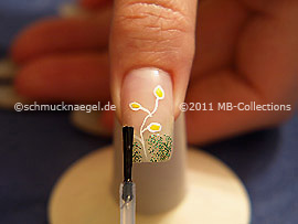 The clear nail lacquer protects the nail art