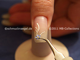 Tweezers and dried flower