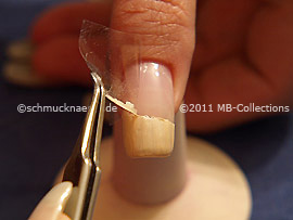 Tweezers and clear adhesive tape