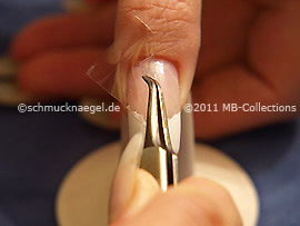 Tweezers and clear adhesive tape