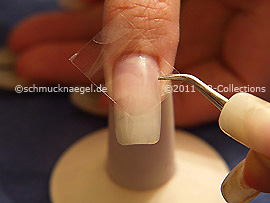 Clear adhesive tape and tweezers