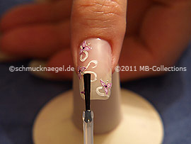 The clear nail lacquer protects the nail art