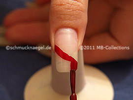 Nail lacquer in the colour dark red