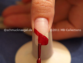 Nail lacquer in the colour dark red