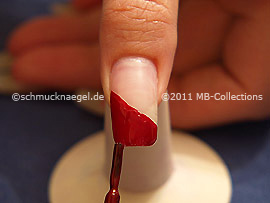 Nail lacquer in the colour dark red