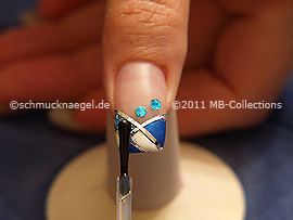 The clear nail lacquer protects the nail art