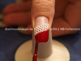 Nail lacquer in the colour dark red