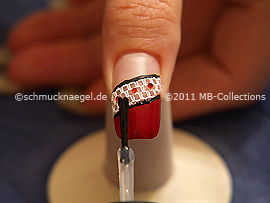 The clear nail lacquer protects the nail art