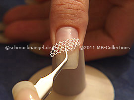 Nail art grid in white and tweezers