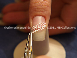 Nail art grid in white and tweezers