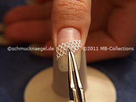 Nail art grid in white and tweezers