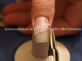Nail art grid in white and tweezers