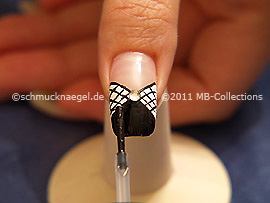 The clear nail lacquer protects the nail art