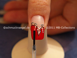 The clear nail lacquer protects the nail art