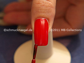 Nail lacquer in the colour red