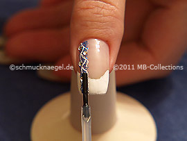 The clear nail lacquer protects the nail art