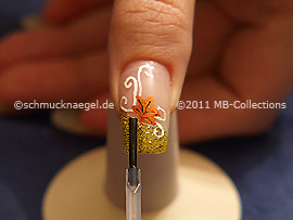 The clear nail lacquer protects the nail art