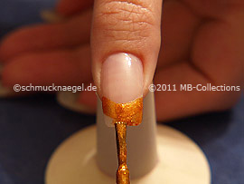 Nail lacquer in the colour brown with glitter particles