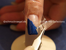Tweezers and clear adhesive tape