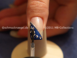The clear nail lacquer protects the nail art