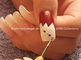 spot-swirl or a thootpick and strass stones in the colour crystal and dark-red
