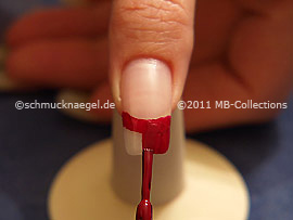 Nail lacquer in the colour dark red