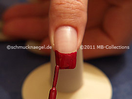 Nail lacquer in the colour dark red