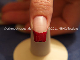 Nail lacquer in the colour dark red