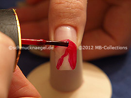 Nail lacquer in the colour dark red