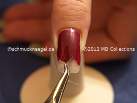 Tweezers and clear adhesive tape