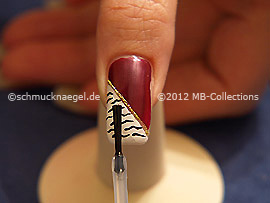 The clear nail lacquer protects the nail art