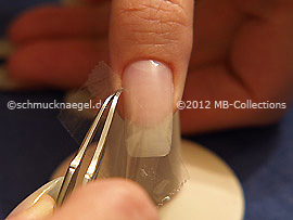 Clear adhesive tape and tweezers