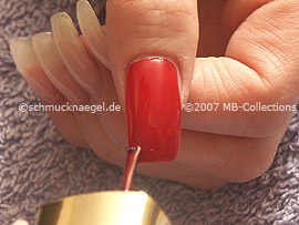 Nail polish in the colour red