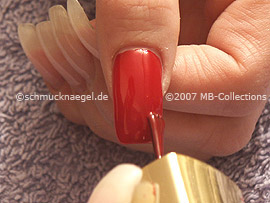 Nail polish in the colour red