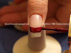 Nail lacquer in the colour dark red