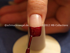 Nail lacquer in the colour dark red