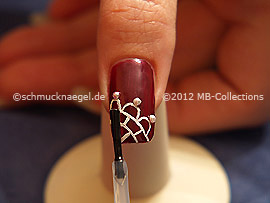 The clear nail lacquer protects the nail art