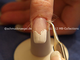 Tweezers and clear adhesive tape