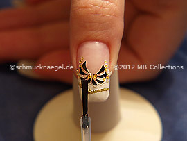 The clear nail lacquer protects the nail art