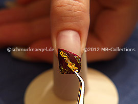 Beaten gold and the tweezers