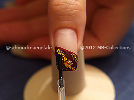 The clear nail lacquer protects the nailart