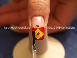 The clear nail lacquer protects the nail art