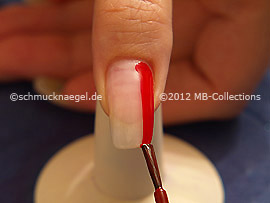 Nail lacquer in the colour red